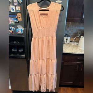 All row peach long dress. Worn twice. No visible damage.